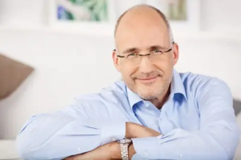 Close,portrait,of,smiling,man,relaxing,at,home